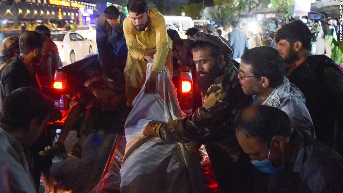 US troops and Afghans killed in suicide attacks outside Kabul airport