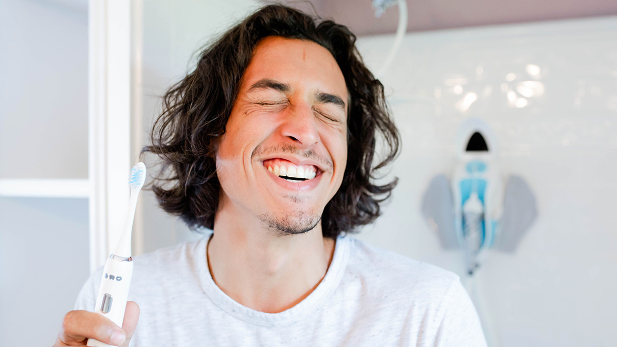 This toothbrush and water flosser connect to your shower for a streamlined oral hygiene routine