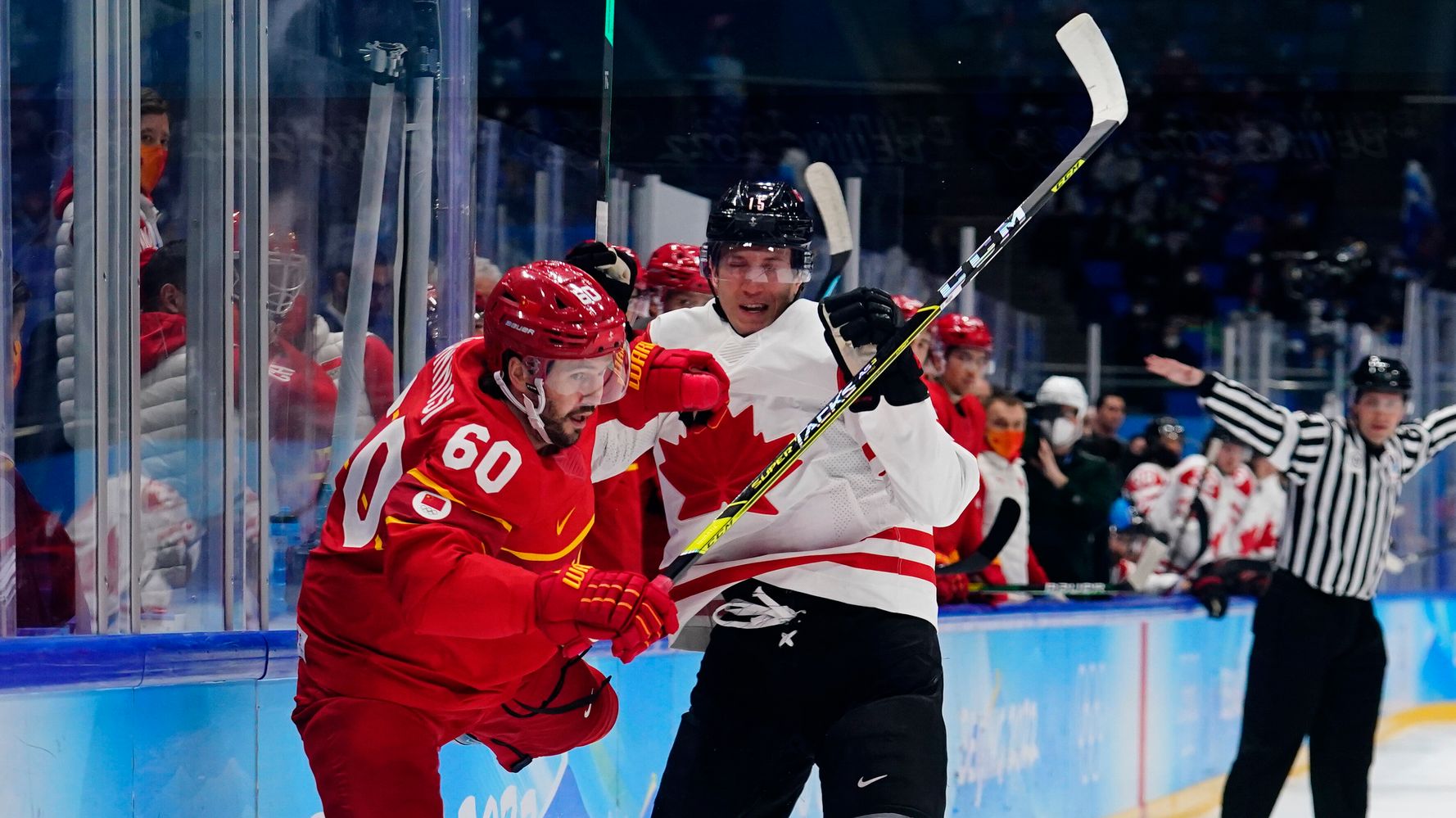 Try Not To Wince At This Supercut Of 'Bone-Crunching' Hockey Moments In Beijing